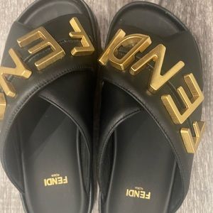 ***Authentic***Sandals wide crossover bands, black leather with golden metal
